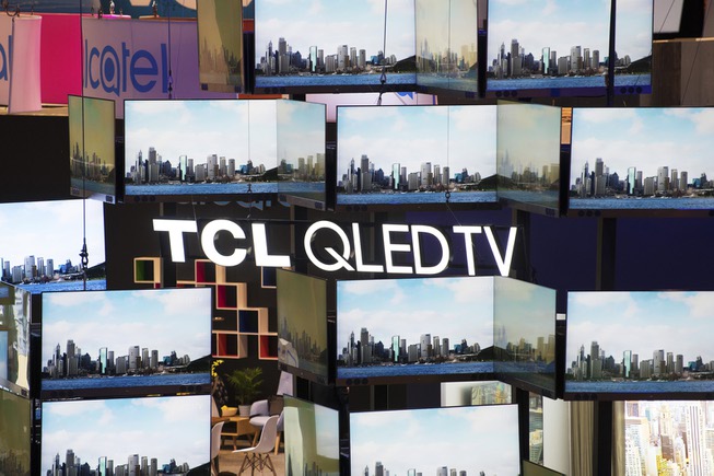 A wall of televisions from TCL is seen during the ...