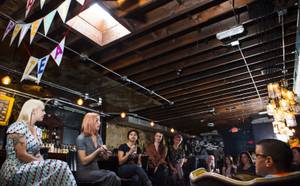 Victoria Hogan, second from left, of Flora Pop, a pop-up wedding and floral design business, speaks during the High Priestess Tea gathering, a women's empowering social, at Velveteen Rabbit in Las Vegas on Saturday, Jan. 13, 2018.
