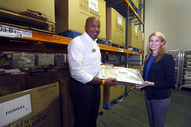 Maurice Johnson, director of operations at Three Square, and Brittany Price, director of Sustainable Operations at MGM Resorts International, pose frozen donated banquet food in a walk-in freezer at the Three Square food bank Wednesday, Jan. 17, 2018. MGM Resorts announced a surplus banquet food donation program they hope will provide 800,0000 meals by 2020.