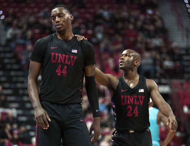 UNLV Rebels forward Brandon McCoy (44) is consoled by UNLV Rebels guard Jordan Johnson (24) after a bad foul and technical which turned the game around versus the New Mexico Lobos during their game at the Thomas & Mack Center on Wednesday, Jan. 17, 2018.