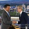 Apple CEO Tim Cook shakes Nevada Gov. Brian Sandoval's hand after his speech during a ceremony celebrating a new Apple warehouse on Wednesday, Jan. 17, 2018, in Reno.
