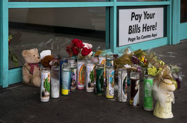 A memorial grows for Celia Luna, she a store employee at the Express Cash Checking on Jones Boulevard near Vegas Drive who was recently killed there opening up by robbery suspects on Thursday, Jan. 18, 2018.