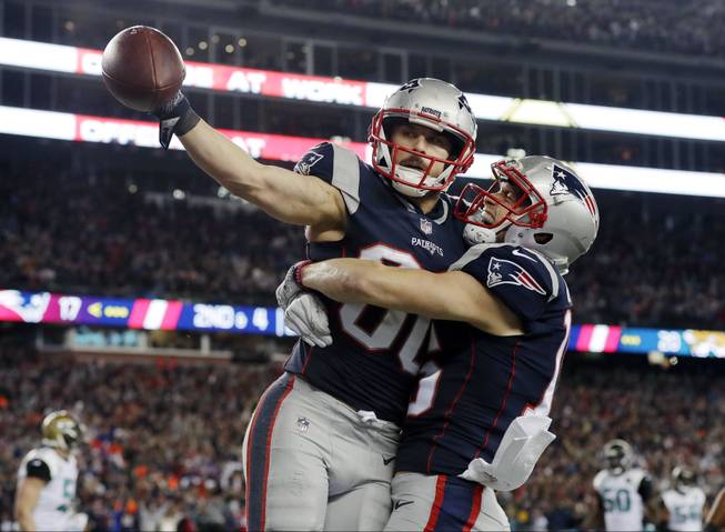 New England Patriots wide receiver Danny Amendola, left, celebrates his touchdown catch with Chris Hogan, right, during the second half of the AFC championship NFL football game against the Jacksonville Jaguars, Sunday, Jan. 21, 2018, in Foxborough, Mass. 