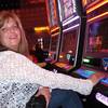 In this May 21, 2012, file photo Donna Kiddie, of Point Pleasant Beach, N.J., plays a "Sex And The City" slot machine at the Revel casino in Atlantic City, N.J.