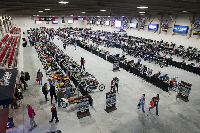 Potential buyers browse through a display of motorcycles during the ...