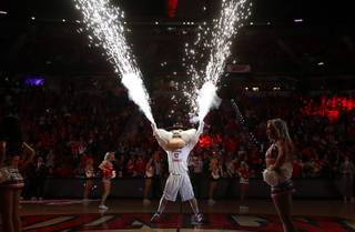 Sparks fly from the gloves of UNLV mascot Hey Reb before a game against San Diego State at the Thomas & Mack Center Saturday, Jan. 27, 2018.