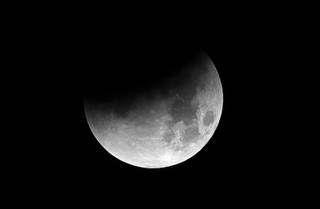 4:10 a.m.  - The moon is starting to be covered by the earth's shadow during a lunar eclipse Wednesday morning Jan. 31, 2018.