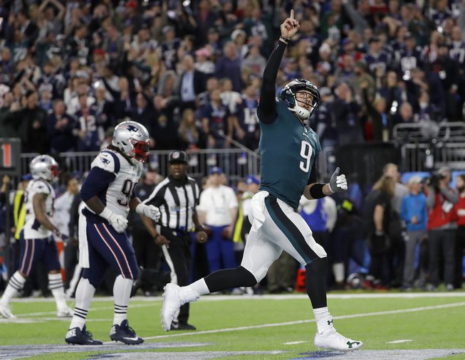 Philadelphia Eagles quarterback Nick Foles (9) celebrates after throwing a ...