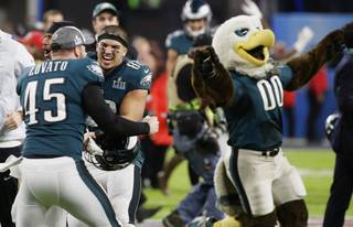 Philadelphia Eagles long snapper Rick Lovato (45) and tight end Trey Burton (88) celebrate after winning the NFL Super Bowl 52 football game against the New England Patriots Sunday, Feb. 4, 2018, in Minneapolis. The Eagles won 41-33. 
