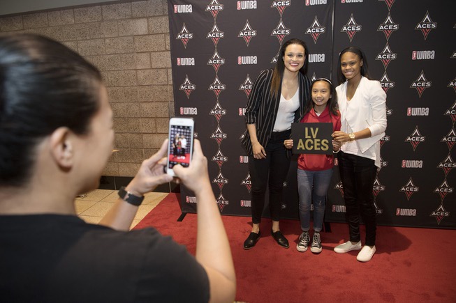 Lauren Mercado has her photo taken with Las Vegas Aces ...