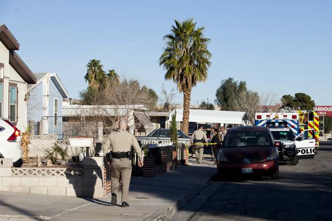 Crime scene investigators and Metro Police are on the scene of a construction death at a mobile home park near Nellis Boulevard and Desert Inn Road where a construction worker was killed after a section of a mobile fell on him, Thursday, February 8, 2018.