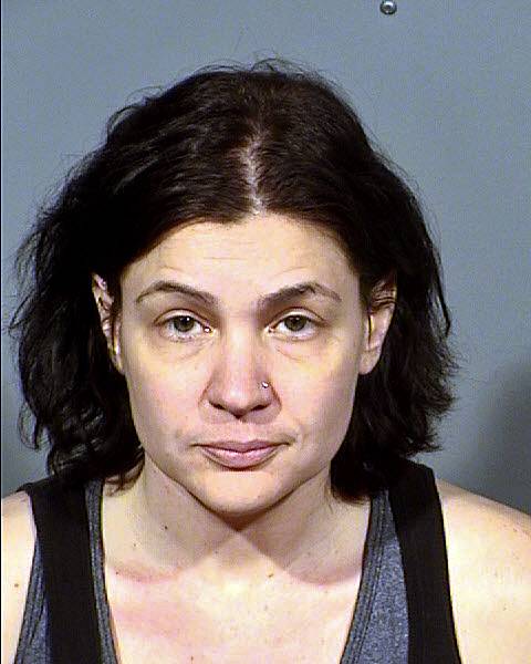 Local woman accused of texting nude photos to her ex of 
