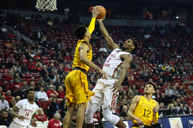 Shakur Juiston (10) tries for a lay up while Wyoming's ...