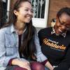 Rachelle Faroul, right, and her partner, Hanako Franz, sit outside their new home in Philadelphia, Nov. 11, 2017. “I had a fair amount of savings and still had so much trouble,” said Faroul, who was rejected twice by lenders. 
