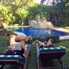 This Dec. 24, 2017, photo taken in Cozumel, Mexico, shows people relaxing by the pool in the yard of their Airbnb rental. Mexico is a popular vacation destination for winter and spring. But big decisions await travelers, especially those uninterested in the all-inclusive resorts that Cancun is known for. 