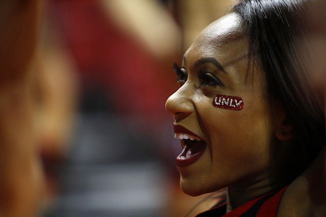 A UNLV cheerleader performs during a game against the Fresno ...