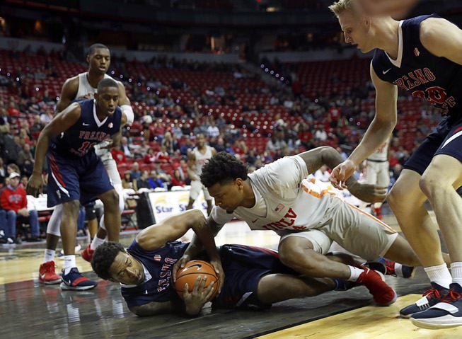 Fresno State Bulldogs guard Ray Bowles Jr. (22) and UNLV ...