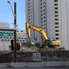 A workman operates an excavator at the site of the former Las Vegas Club casino on Main Street between Ogden Avenue and Fremont Street in downtown Las Vegas Thursday, Feb. 22, 2018. 
