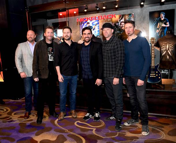 Nickelback is honored with an exclusive memorabilia case at the Hard Rock Hotel and Casino. Pictured: (l-r) Chas Smith Vice President of Entertainment at Hard Rock Hotel & Casino, Chad Kroeger - Nickelback lead guitar, Ryan Peake - Nickelback guitar, Beau Dobney Artis Relations and Exhibits Coordinator at Hard Rock Hotel & Casino, Mike Kroeger - Nickelback bass guitar and Daniel Adair - Nickelback drums.Thursday, February 22, 2018. CREDIT: Glenn Pinkerton/Las Vegas News Bureau