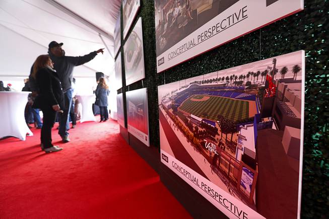 People look over artist illustrations during a groundbreaking ceremony for Las Vegas Ballpark, a 10,000-fan capacity baseball stadium and future home of the Las Vegas 51s, in Summerlin Friday, Feb. 23, 2018.