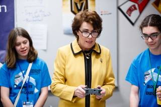 Congresswoman Jacky Rosen (NV-03) concentrates while controlling a robot during a meeting with Greenspun Junior High School teachers and students from the schools three winning robotics teams, Friday, Feb. 23, 2018. The VEX IQ Robotics teams recently won the State Championship Tournament and have been invited to represent Nevada in the 2018 VEX Robotics Worlds Competition this April in Louisville, Kentucky.