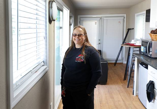 Wendy Grant, crisis intervention coordinator, poses in a tiny home, made from a shipping container, at Veterans Village 2 near downtown Las Vegas Saturday, Feb. 24, 2018.  Veterans Village plans for an initial community of 11 tiny homes.