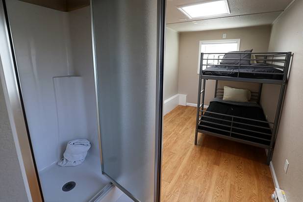A view of the bedroom and shower in a tiny home, made from a shipping container, at Veterans Village 2 near downtown Las Vegas Saturday, Feb. 24, 2018.