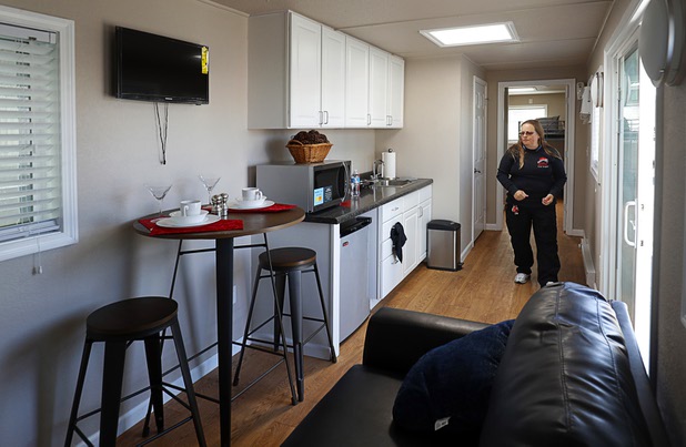 Wendy Grant, crisis intervention coordinator, walks though a tiny home, made from a shipping container, at Veterans Village 2 near downtown Las Vegas Saturday, Feb. 24, 2018.  Veterans Village plans for an initial community of 11 tiny homes.