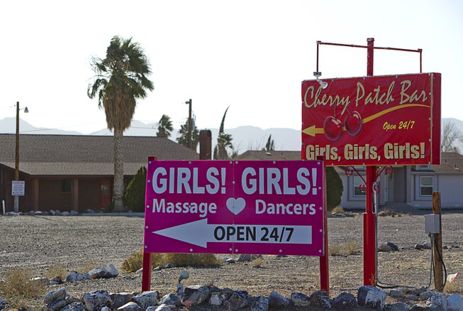 Signs give directions to brothels in Crystal on Dec. 20, ...