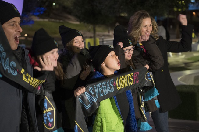 Fans cheer for a camera before the Las Vegas Lights ...