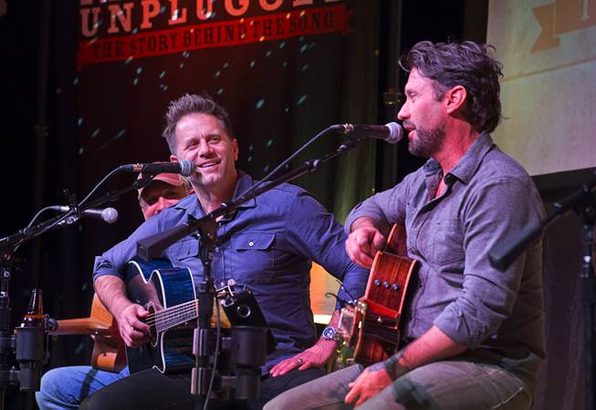 Aaron Benward, left, listens toTravis Howard during Nashville Unplugged in ...