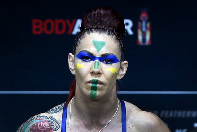 Cris Cyborg of Brazil poses on the scale during UFC ...