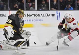 Even after dropping his stick, Vegas Golden Knights goaltender Marc-Andre Fleury (29) stops a point blank shot by Ottawa Senators defenseman Mark Borowiecki (74) during their NHL hockey game Friday, March 2, 2018, at T-Mobile Arena in Las Vegas. Ottawa won the game 5-4.