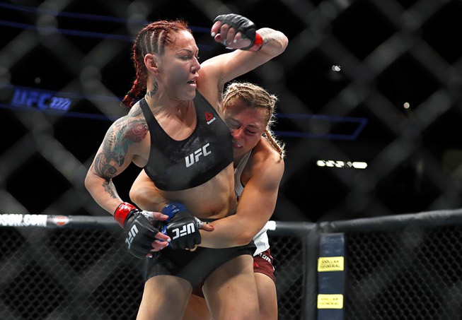 Women's featherweight champion Cris Cyborg, left, of Brazil fights with ...