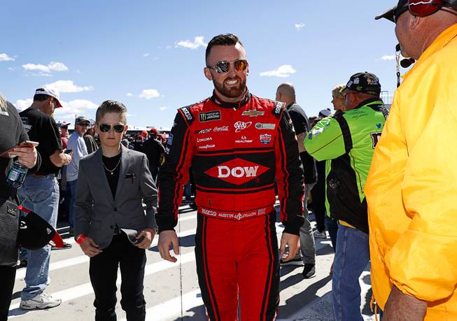Driver Austin Dillon heads to driver introductions before the NASCAR Pennzoil 400 race at the Las Vegas Motor Speedway Sunday March 4, 2018.