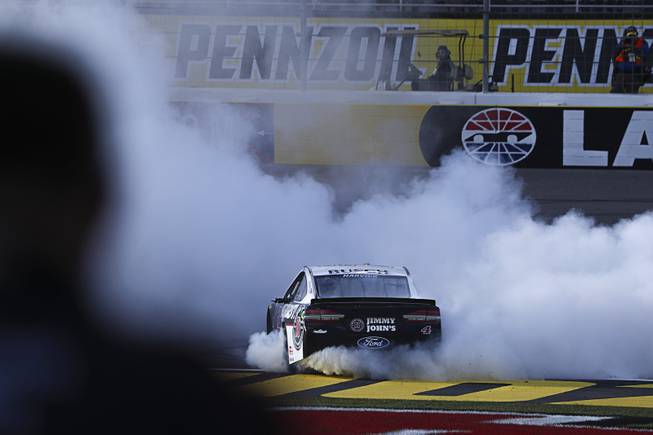Driver Kevin Harvick (4) celebrates with a burnout after winning ...
