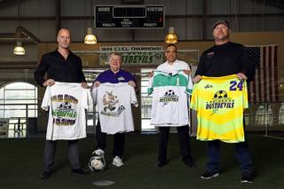 Former members of the Las Vegas Dustdevils indoor soccer team, from left, Benny Erickson, assistant coach John Kennedy, Daniel Barber, and Doug Borgel, pose in a soccer facility at Freedom Park Tuesday, March 6, 2018. The team won the Continental Indoor Soccer League championship in 1994.