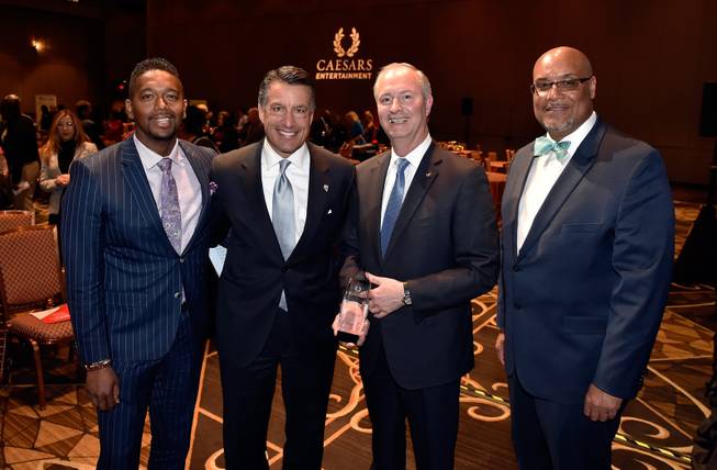 From left, Nathan Armogan, general manager of Planet Hollywood Resort & Casino; Nev. Gov. Brian Sandoval; Steve Hill, president and chief operating officer of the LVCVA and chairman of the Las Vegas Stadium Authority and Karlos LaSane, Caesars Entertainment regional vice president of government relations and community affairs attend Caesars Entertainment Community Review reception at the Rio All-Suites Hotel & Casino Monday, March 5, 2018, in Las Vegas.
