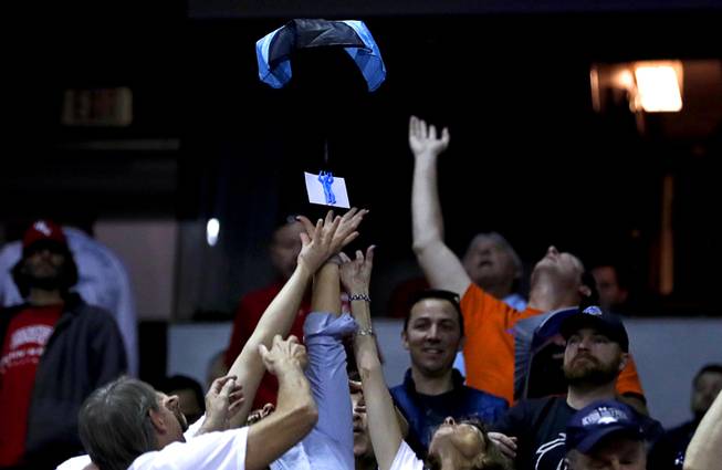 A certificate for a Port of Subs sandwich floats down to fans during a game against UNR in the 2018 Mountain West Men's Basketball Championship at the Thomas & Mack Center Thursday, March 8, 2018.