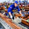 Teams compete in the Bricklayer 500 championship outside the Las Vegas Convention Center, Jan. 24, 2018. In contrast with other trade shows, displays of technology still play second fiddle to the actual race.