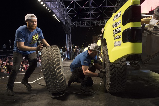 Tires are rotated during the Mint 400 pit crew challenge ...
