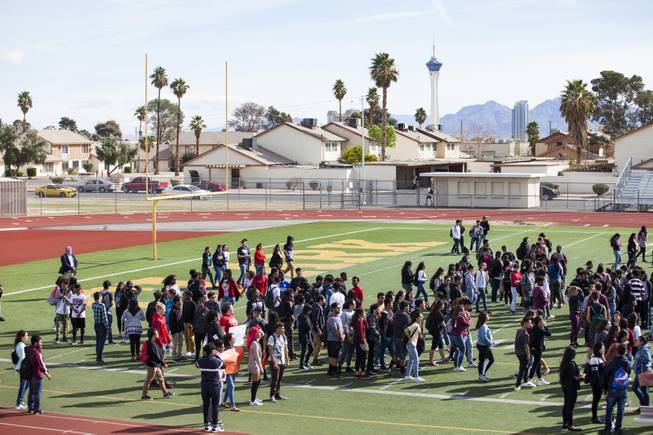 Clark High School students make their way onto the field for a nationwide school walkout to honor the victims of the Feb. 14 Marjory Stoneman Douglas High School mass shooting and to protest gun laws, Wednesday, March 14, 2018. Clark High School students honored the Parkland, FL Marjory Stoneman Douglas High School shooting victims with seventeen minutes of silence, one minute for each of the victims.