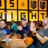 From left, Justin Leigh and Steve Haft of Seattle and Matt Martinkus of Yakima, Wash., cheer as they watch the first rounds of March Madness at Beerhaus, Thursday, March 15, 2018.