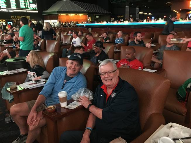 Jeff Sullivan Jr., left, and his father, Jeff Sr., watch the NCAA Tournament at the Westgate Las Vegas Superbook on March 15, 2018.