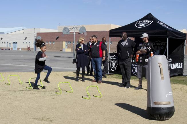 The Raiders, including Raider alumni Reggie Kinlaw and their mascot Raider Rusher, and the Nevada Dairy Council gave Sandy Searles Miller Academy a $10,000 Hometown Grant award in conjunction with the Fuel up to Play 60 campaign, which encourages kids to be active an hour a day, Wednesday, February 28, 2018.  MICK ACKERS