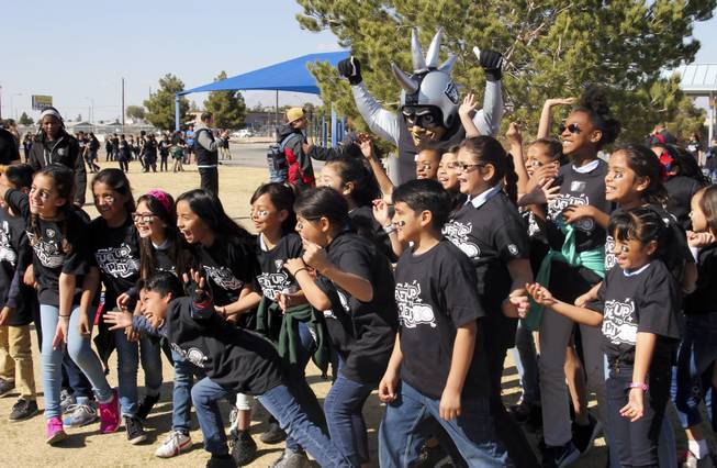 The Raiders, including Raider alumni Reggie Kinlaw and their mascot Raider Rusher, and the Nevada Dairy Council gave Sandy Searles Miller Academy a $10,000 Hometown Grant award in conjunction with the Fuel up to Play 60 campaign, which encourages kids to be active an hour a day, Wednesday, February 28, 2018.  MICK ACKERS