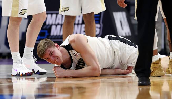 Purdue center Isaac Haas grimaces after falling on his right elbow during the second half of a first round game in the NCAA college basketball tournament against Cal State Fullerton, Friday, March 16, 2018, in Detroit. 
