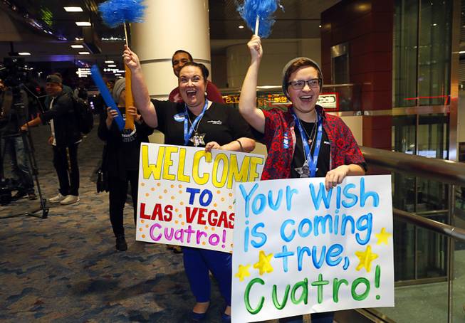 Make-A-Wish volunteers Tammy Wilkins and her son Joseph Wilkins, 17, welcome recipient Nicolas "Quatro" Dones IV at McCarran International Airport Wednesday, March 21, 2017. Quatro arrived on Allegiant Air's 1,000th wish flight. A monster truck fan, Quatro wanted to come to Las Vegas to attend this weekend's Monster Jam World Finals XIX at Sam Boyd Stadium.