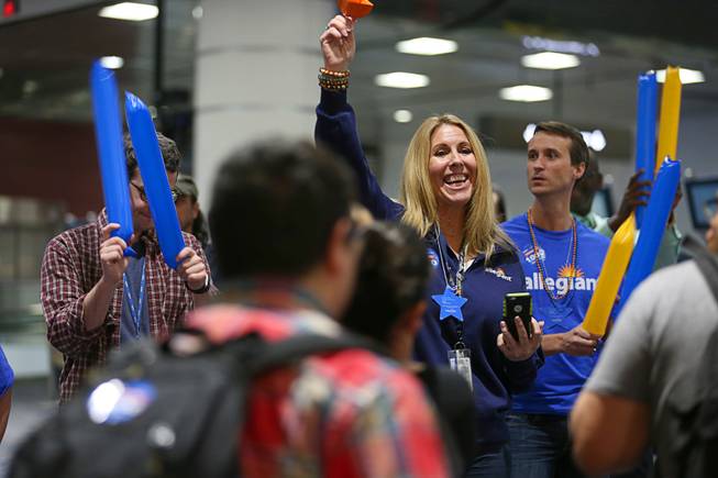 Make-A-Wish volunteers and Allegiant Air employees welcome arriving passenger as they wait for Nicolas "Quatro" Dones IV at McCarran International Airport Wednesday, March 21, 2017. Quatro arrived on Allegiant Air's 1,000th wish flight. A monster truck fan, Quatro wanted to come to Las Vegas to attend this weekend's Monster Jam World Finals XIX at Sam Boyd Stadium.