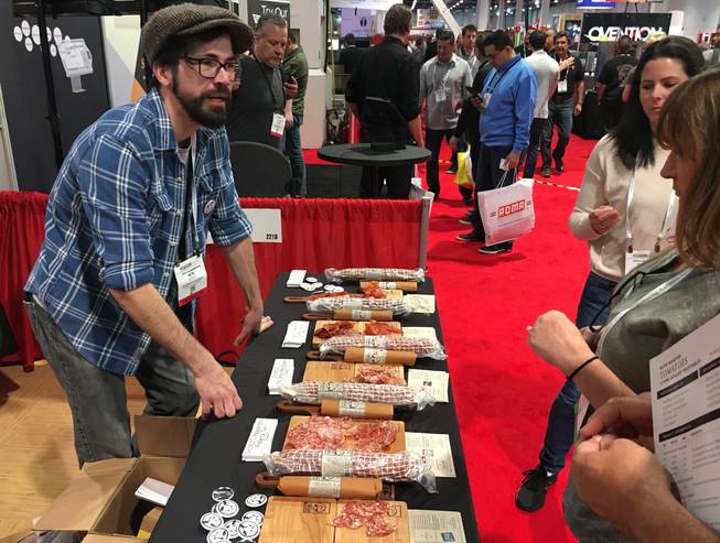 Ben Parker from Charlito's Cocina in New York shares some product at the International Pizza Expo at the Las Vegas Convention Center on March 21.